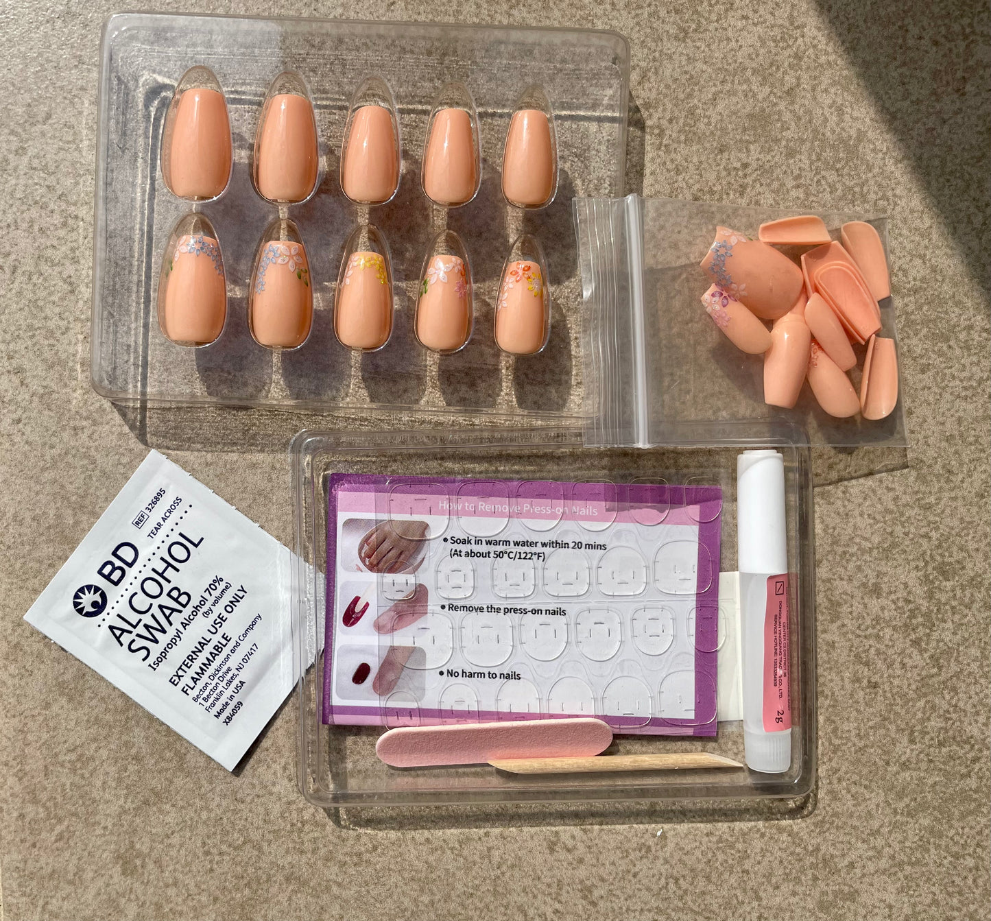 Leewa Beauty Short Pink Coffin nails with flowers called Blossom Coffin with nailkit nail glue glue nail tabs double sided nail file user manual alcohol pad and cuticle stick