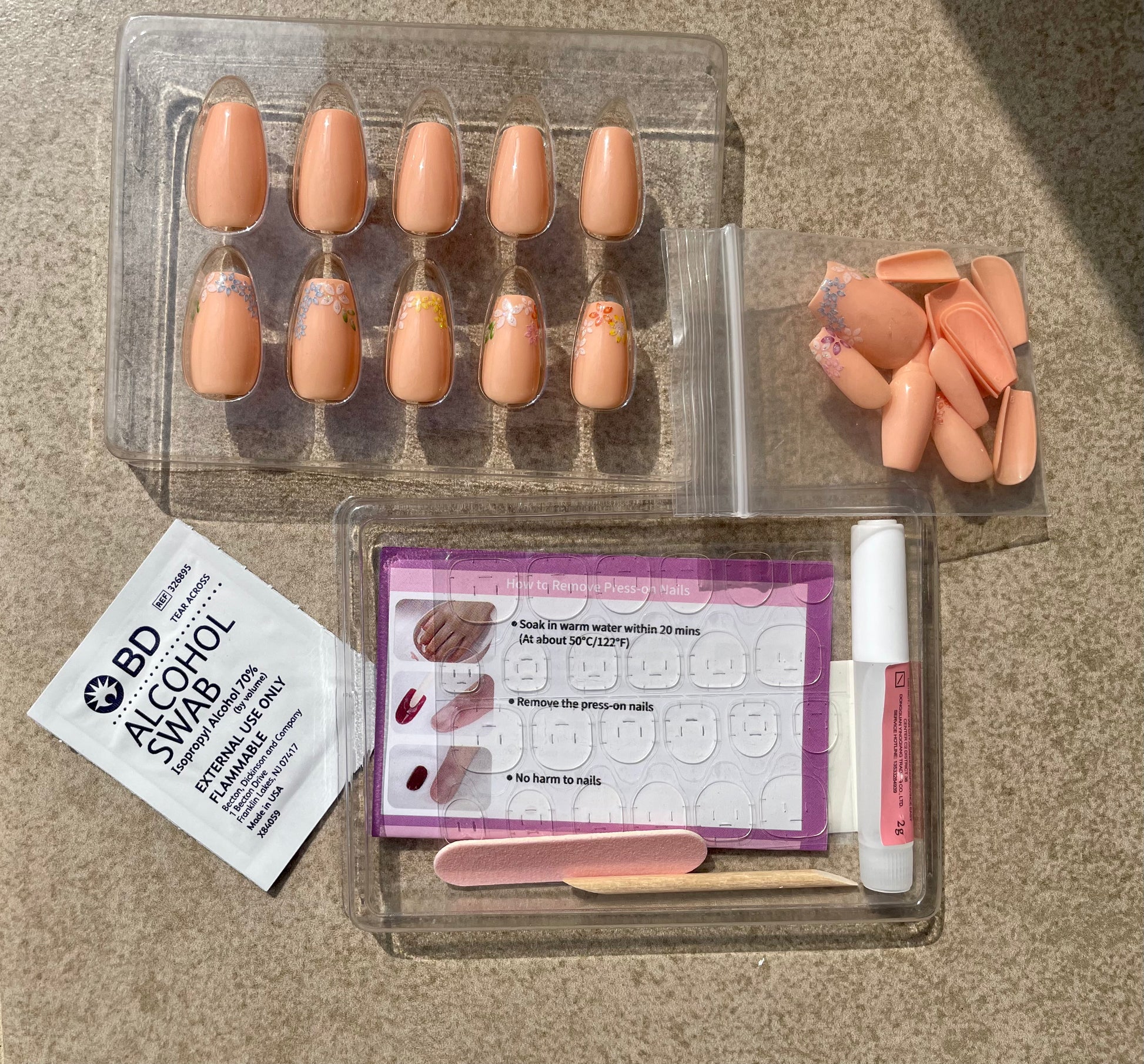 Leewa Beauty Short Pink Coffin nails with flowers called Blossom Coffin with nailkit nail glue glue nail tabs double sided nail file user manual alcohol pad and cuticle stick