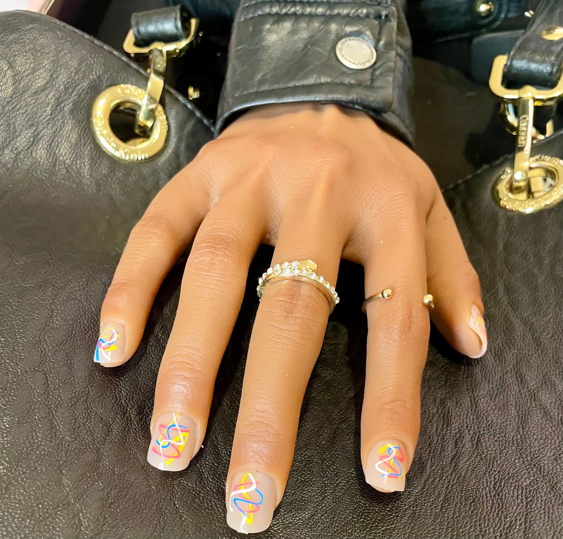 Short Square press on nail with colors red blue white yellow called Artisan Square from Leewa Beauty