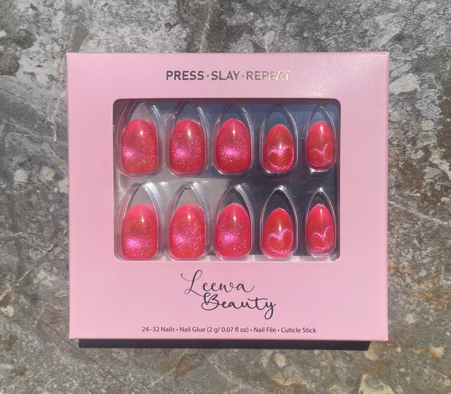 Pink Venom press-on nails - hot pink cat eye with hearts, extra short almond shape in Leewa Beauty box