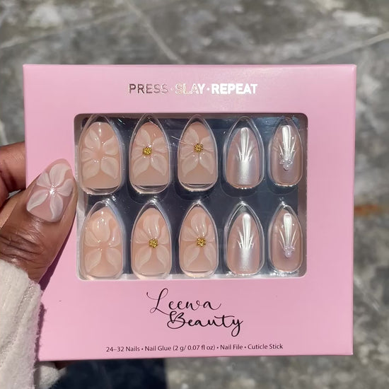 Video of Golden Bloom press-on nails with pearl draped texture, 3D pearl flower and gold foil pinky accent in Leewa Beauty press-on nail brand box– Leewa Beauty

