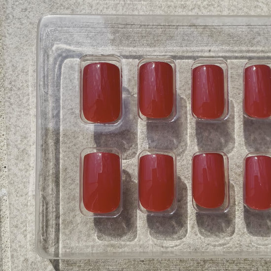 Reusable Short Red Square Press-on Nails in vibrant red. Nails are called Ruby Square and are made by Leewa Beauty 