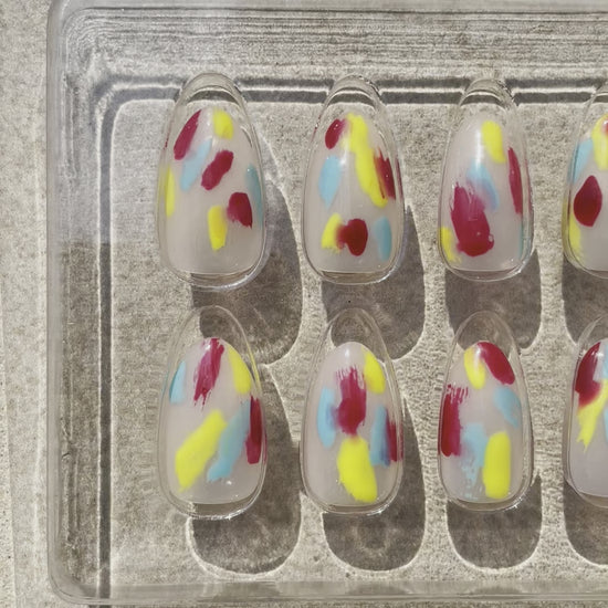 Short Colorful yellow, blue, red Jazzy Almond press-on nails made by Leewa Beauty 